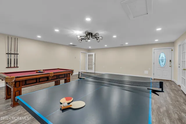 a bedroom with two beds and painted walls