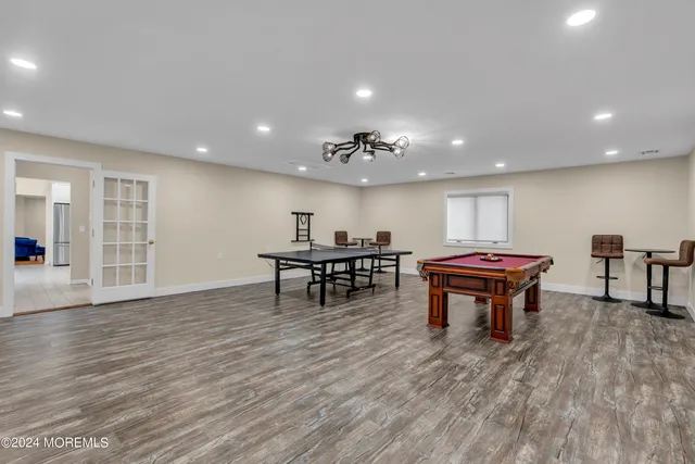 a view of deck with chairs and wooden fence