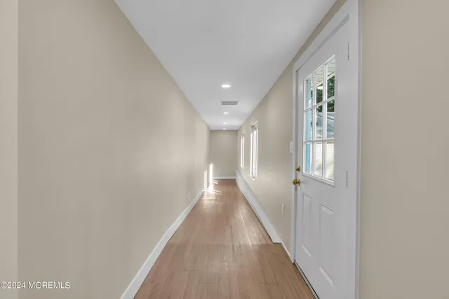 a view of a deck with couches table and chairs and wooden floor