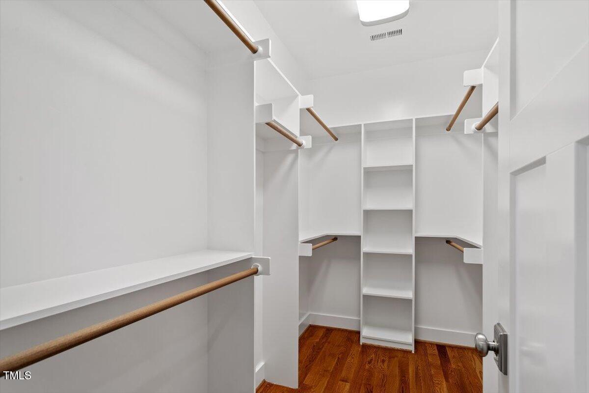 3932 Old Chapel Hill Road Durham, NC 27707 - Photo 25 of 46 a view of walk in closet with empty racks