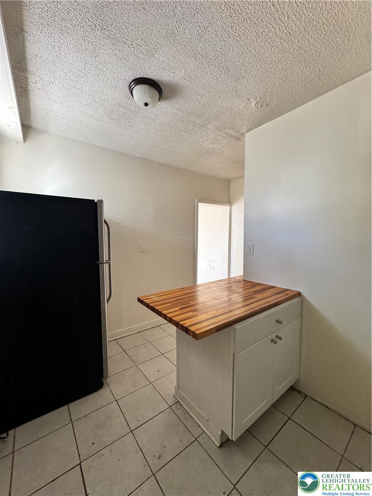 1218 Mechanic Street, Unit 2 Bethlehem, PA 18015 - Photo 9 of 9 a kitchen with a stove and a refrigerator
