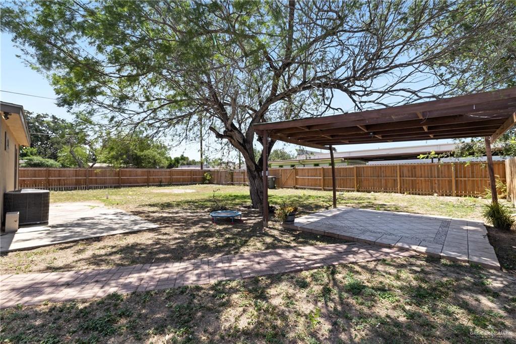 320 Violet Avenue Mission, TX 78574 - Photo 14 of 14 a view of a yard with wooden fence