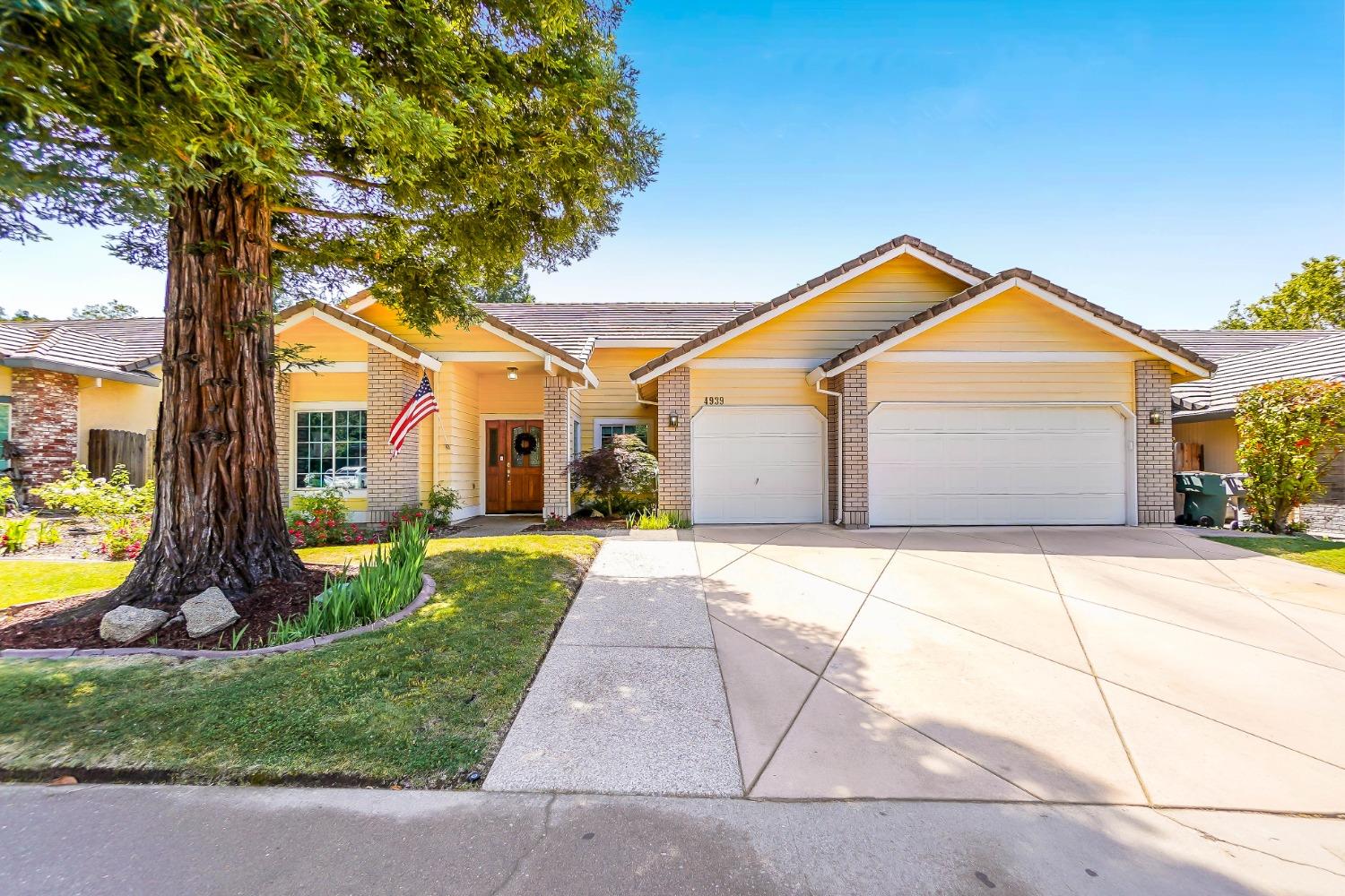 a front view of a house with garden