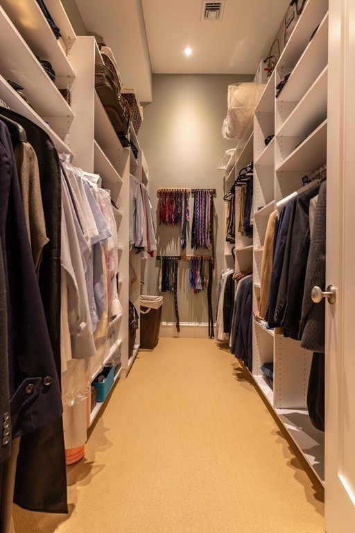 112 Beach Street, Unit 1 Boston, MA 02111 - Photo 13 of 20 a view of walk in closet with clothes and shoes