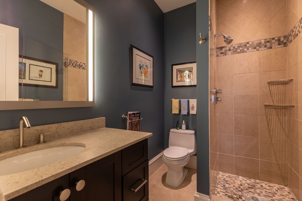 112 Beach Street, Unit 1 Boston, MA 02111 - Photo 16 of 20 a bathroom with a sink a toilet and shower