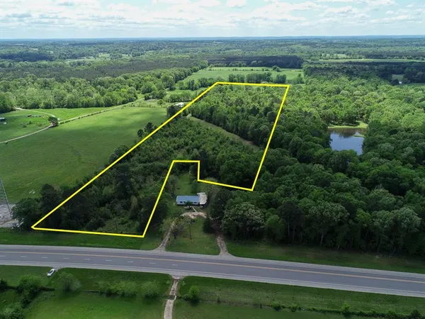 a view of a yard with a swimming pool