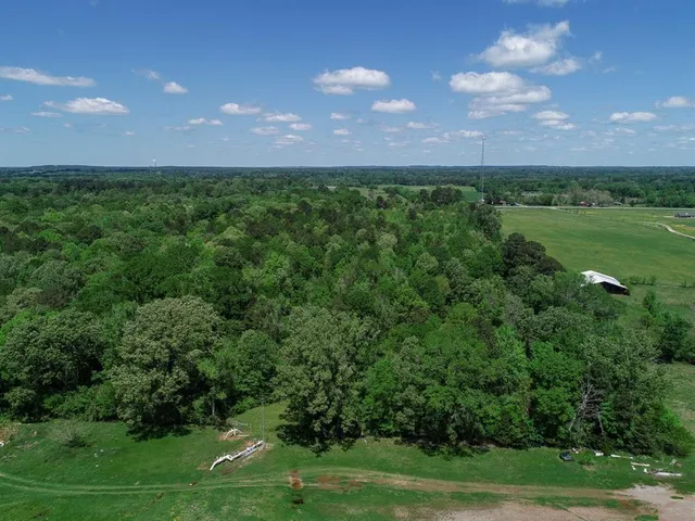 a view of a golf course with a big yard