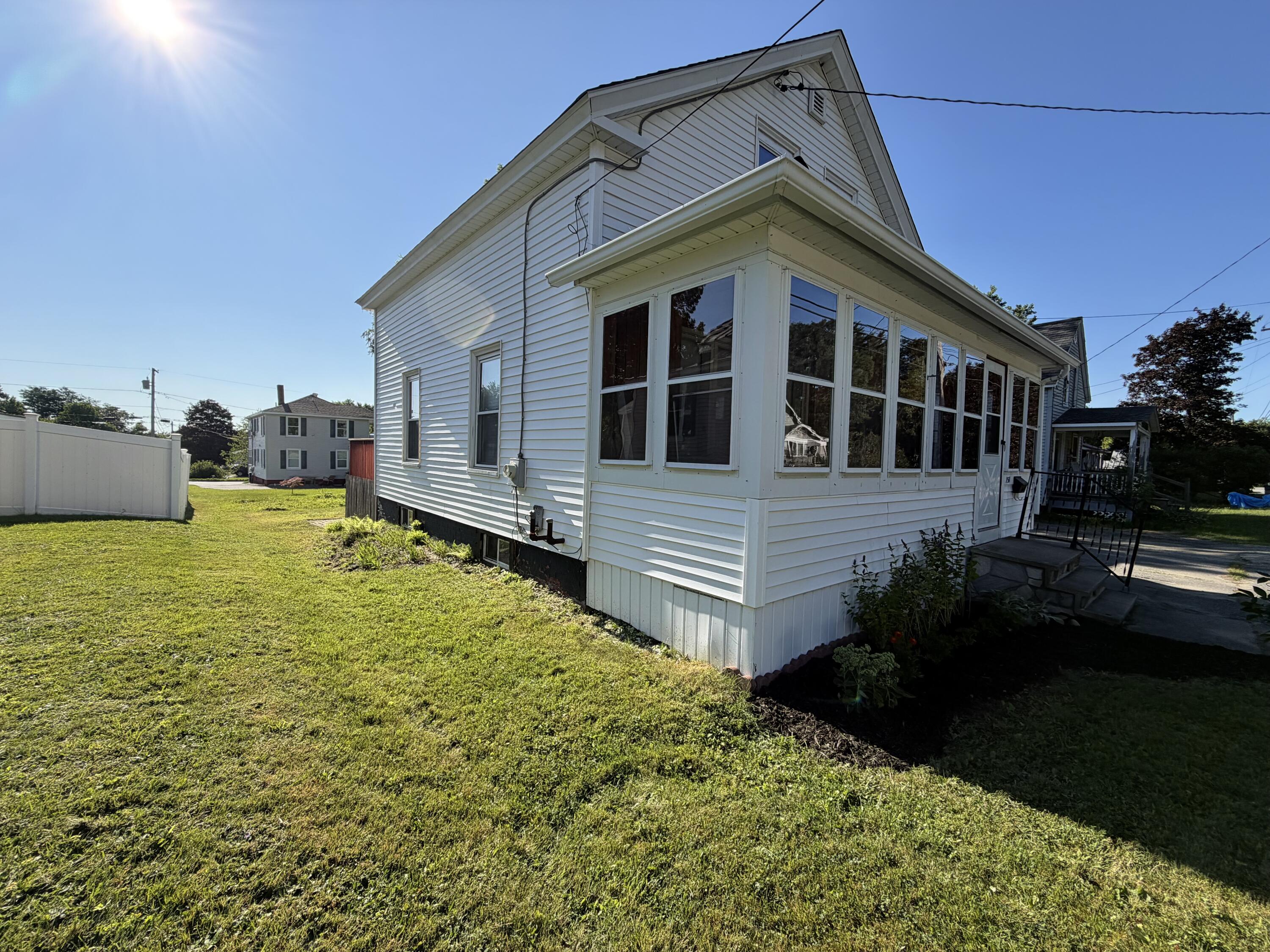 151 Rideout Street Waterville, ME 04901 - Photo 3 of 24 Front enclosed porch