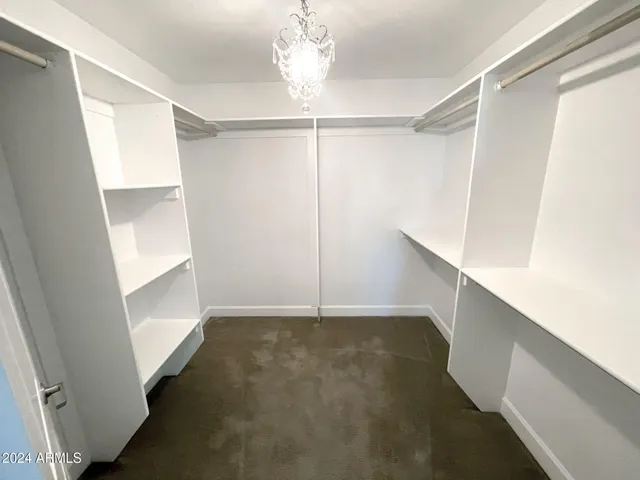 a view of an empty walk in closet