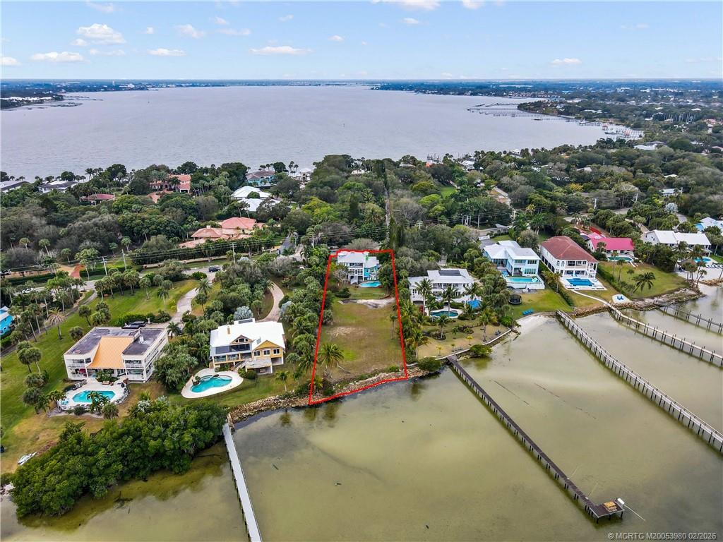 94 North Sewalls Point Road Stuart, FL 34996 - Photo 5 of 35 an aerial view of a houses with a lake