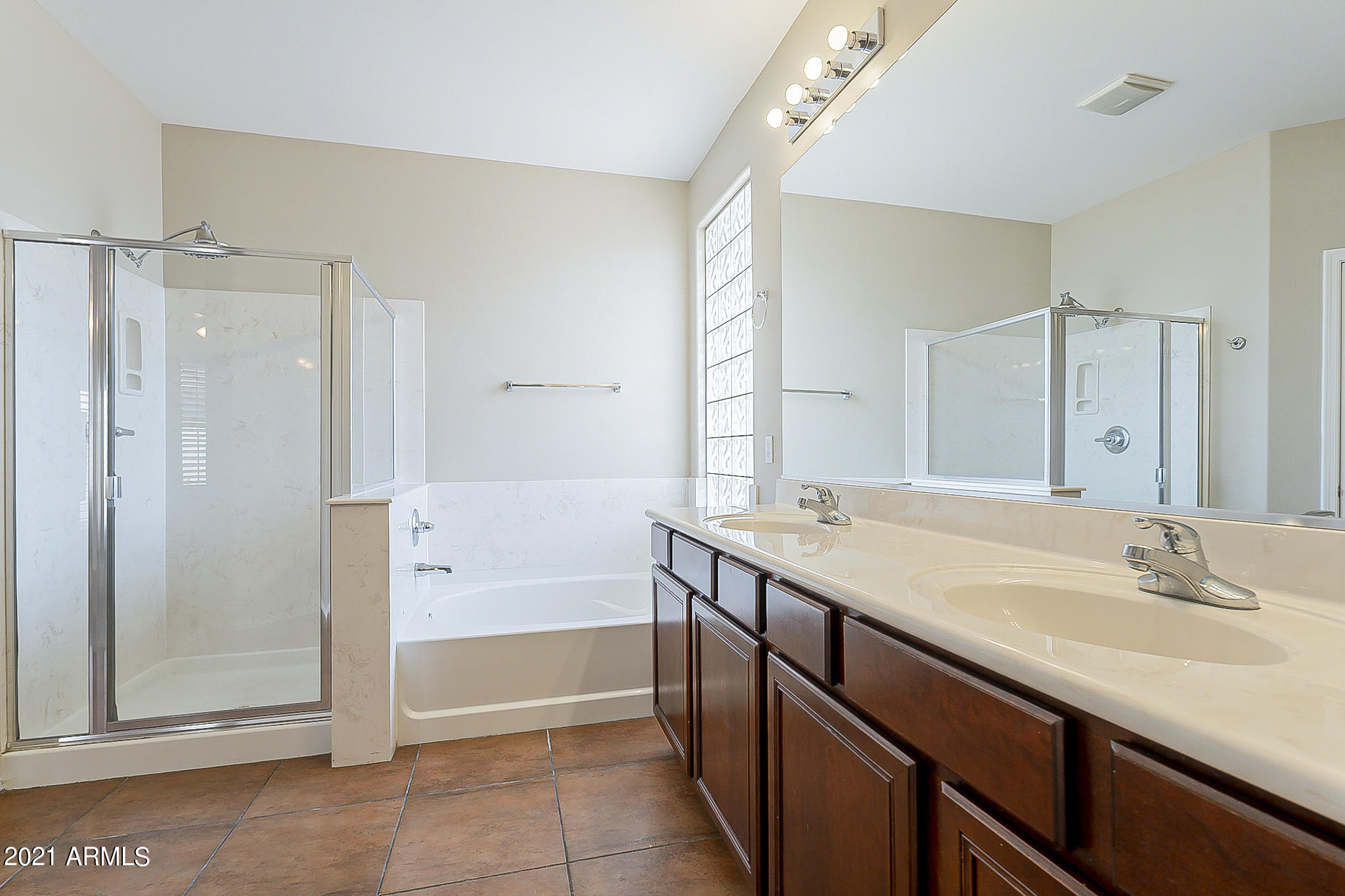 15346 West Boca Raton Road Surprise, AZ 85379 - Photo 30 of 45 a bathroom with a granite countertop sink and a mirror