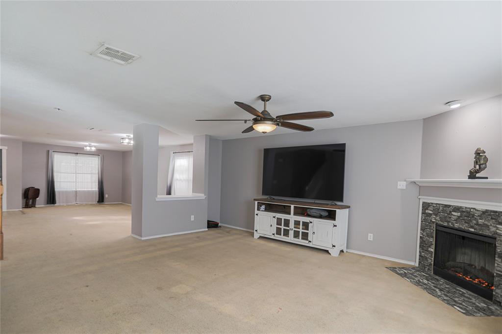 149 Independence Avenue Venus, TX 76084 - Photo 8 of 31 a living room with furniture and a flat screen tv