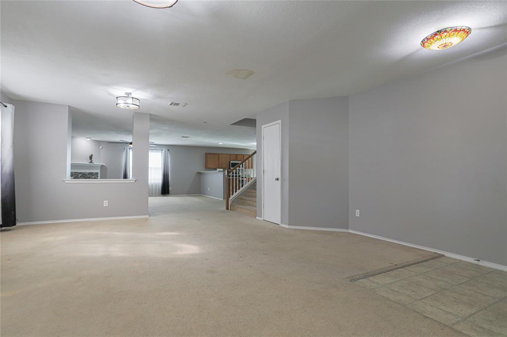 149 Independence Avenue Venus, TX 76084 - Photo 9 of 31 a view of empty room with a fireplace