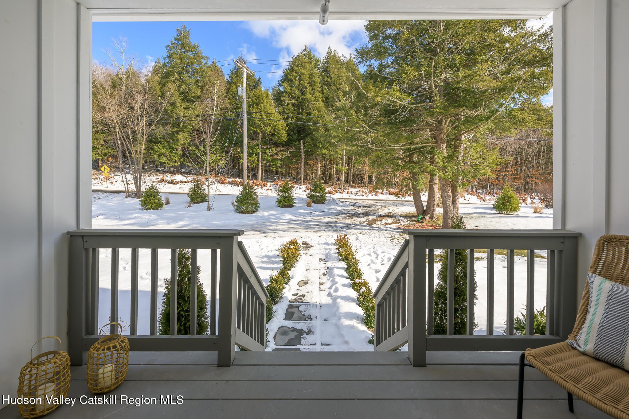 305 Mitchell Hollow Road Windham, NY 12496 - Photo 4 of 39 a view of a porch with a door and chair
