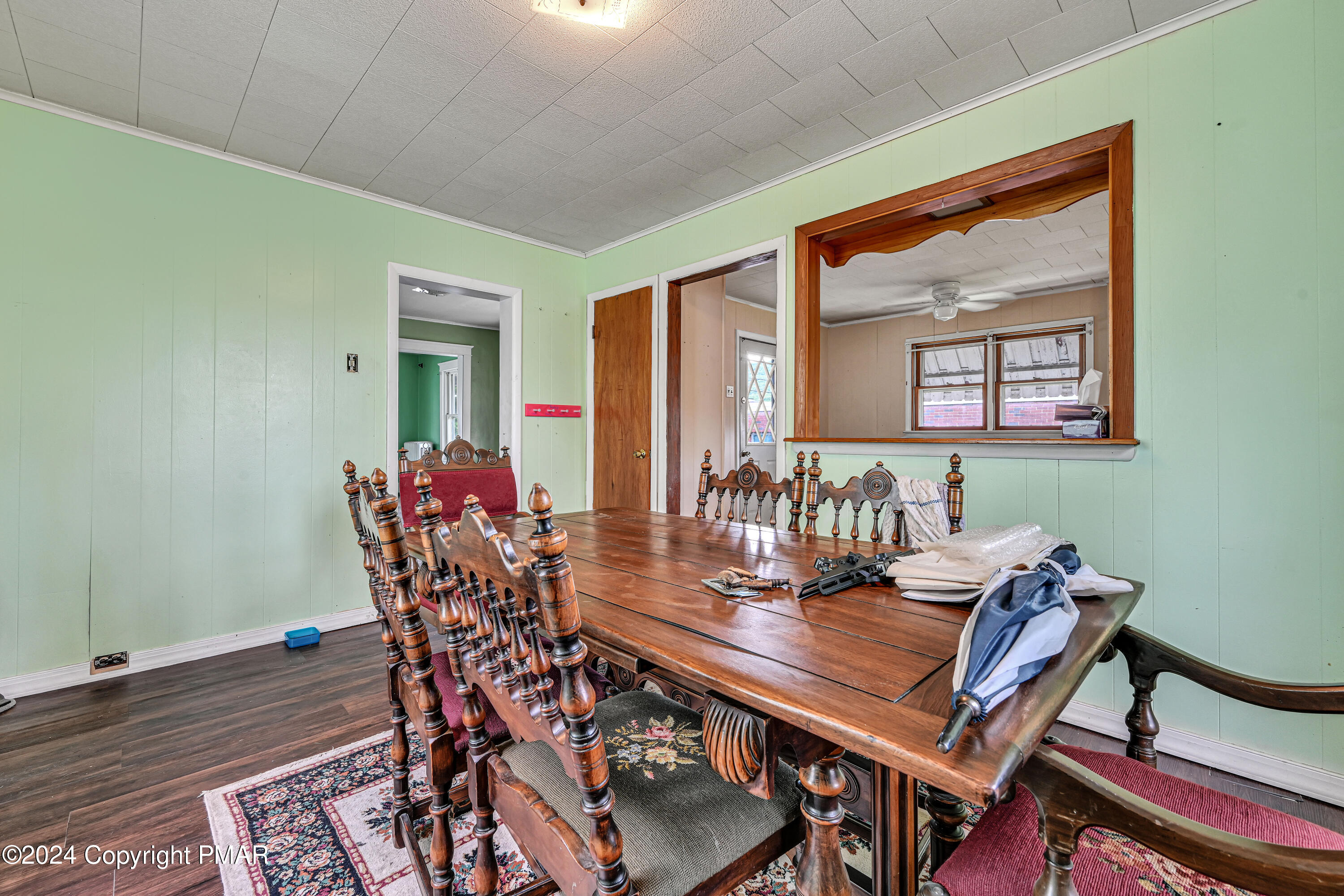 128 North West Street Williamstown, PA 17098 - Photo 13 of 23 a view of a dining room with furniture and a potted plant