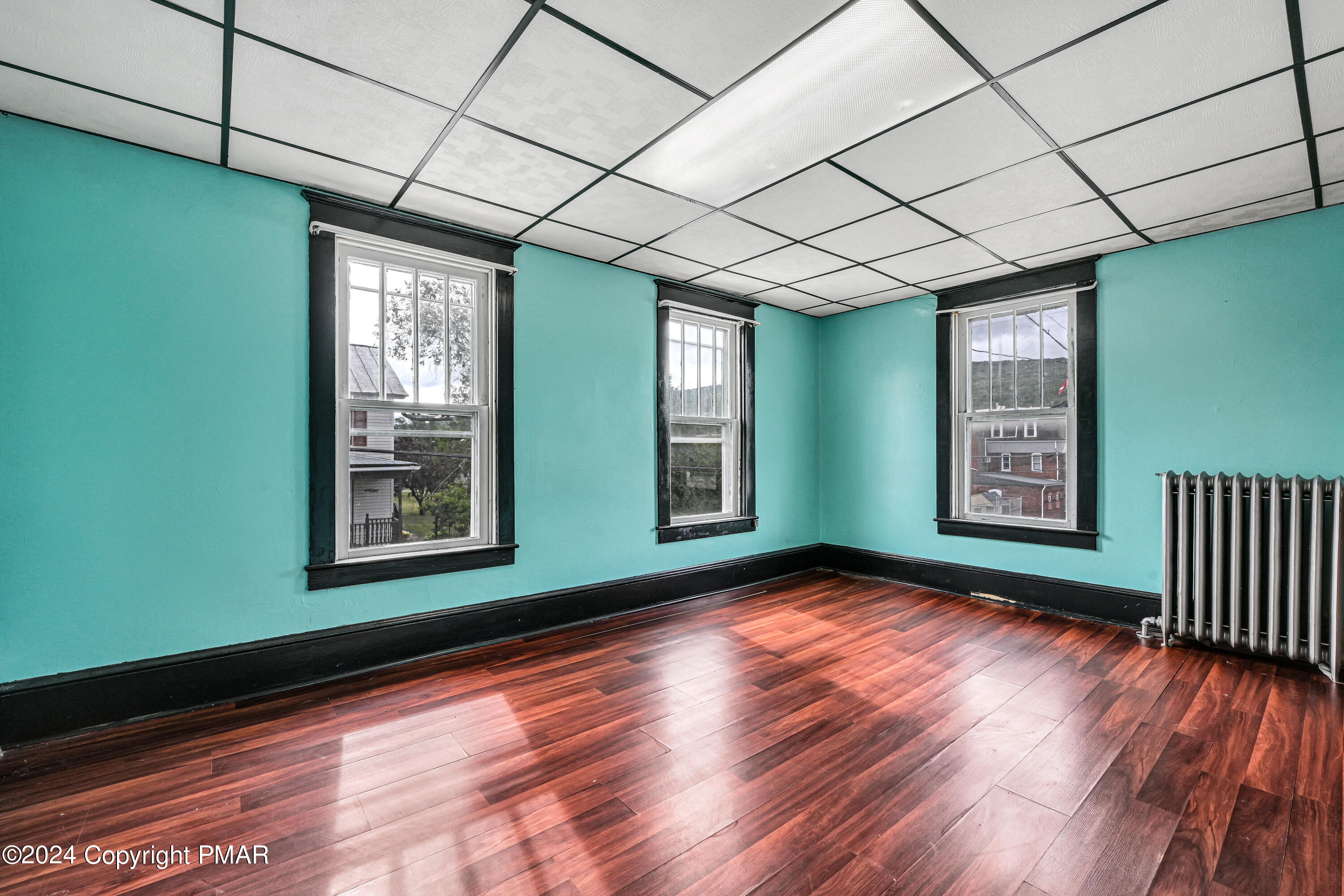 128 North West Street Williamstown, PA 17098 - Photo 14 of 23 a view of an empty room with wooden floor and a window