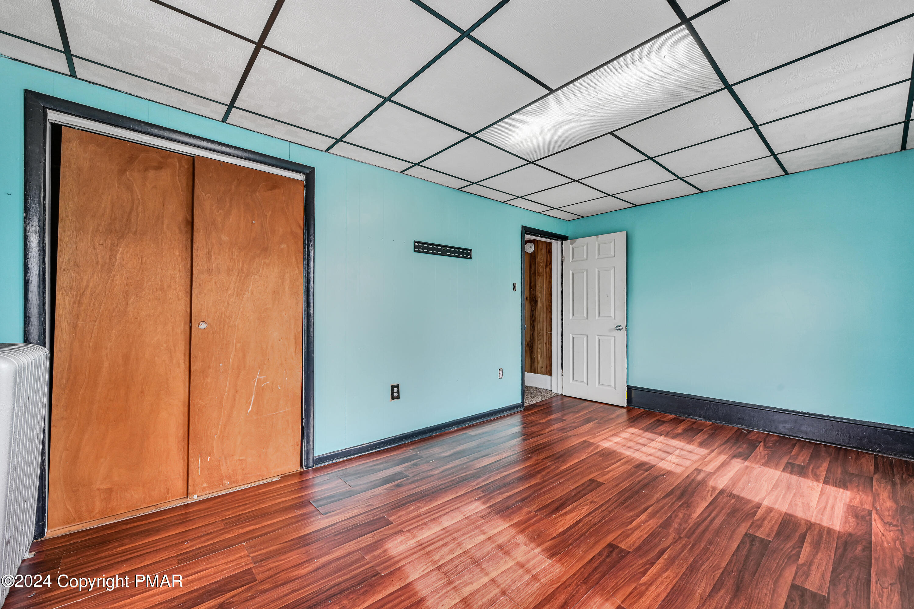 128 North West Street Williamstown, PA 17098 - Photo 15 of 23 a view of empty room with wooden floor and fan