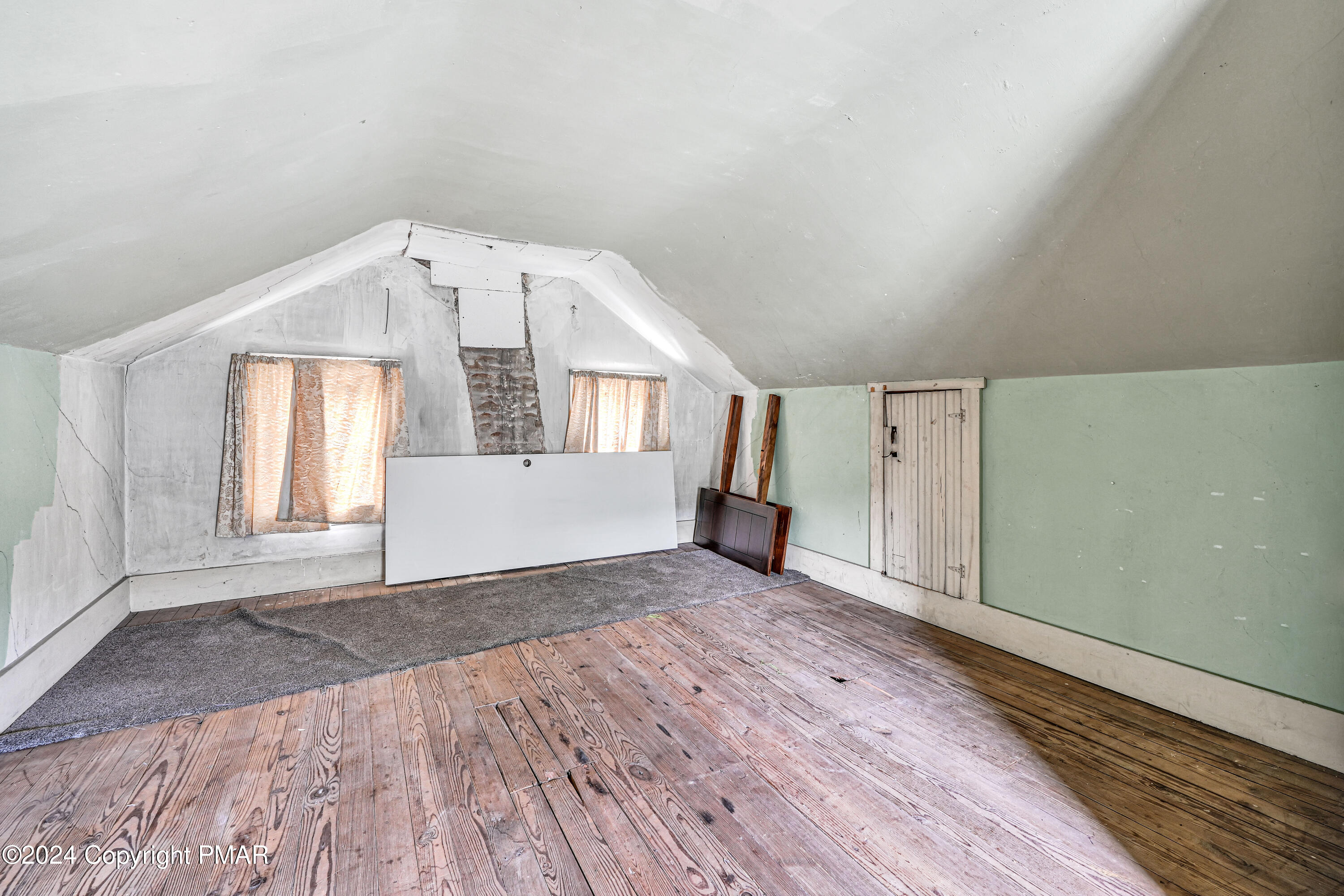 128 North West Street Williamstown, PA 17098 - Photo 18 of 23 a view of an empty room with wooden floor and a window