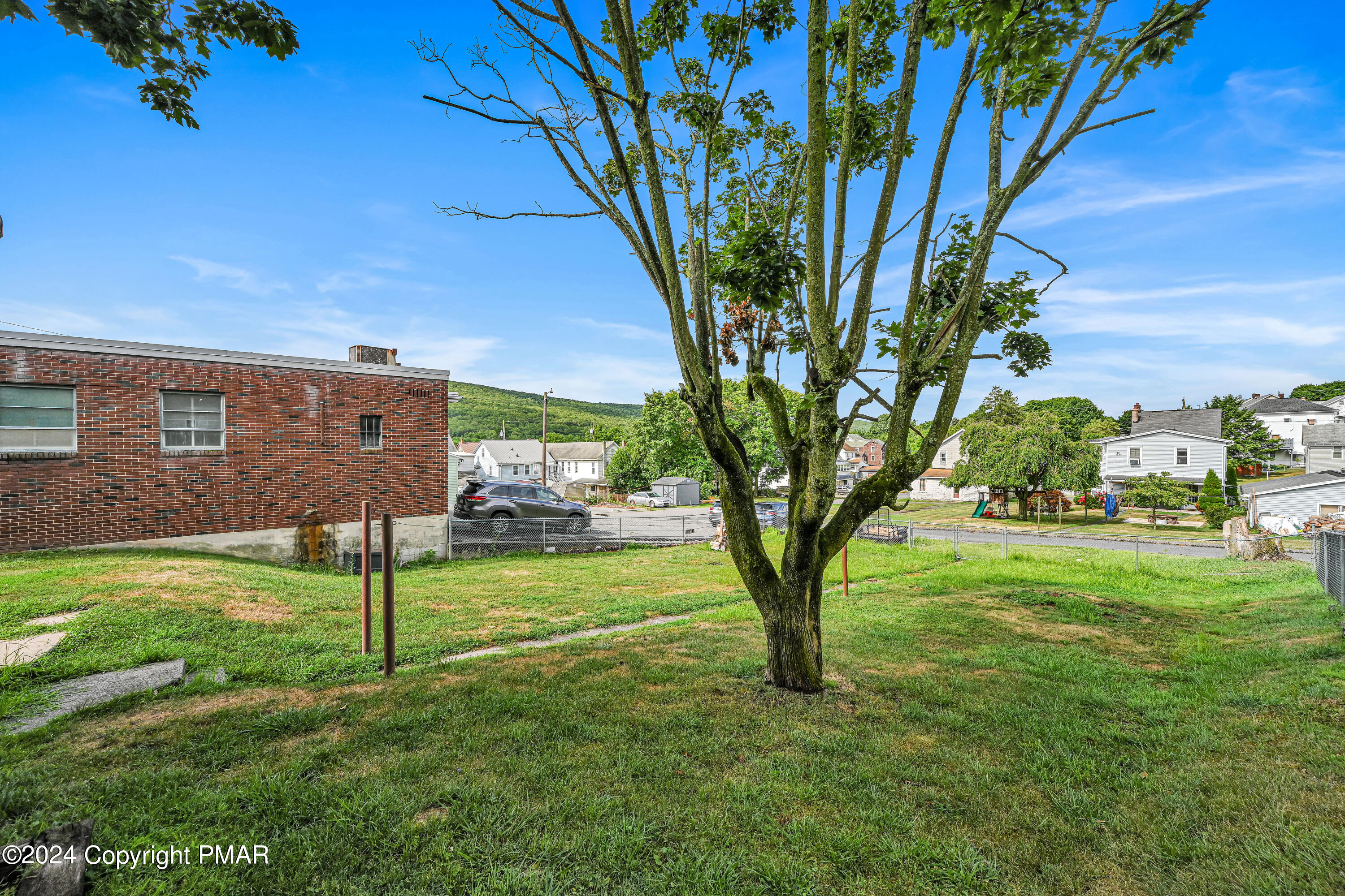 128 North West Street Williamstown, PA 17098 - Photo 23 of 23 a view of a yard in front of a house with a large tree