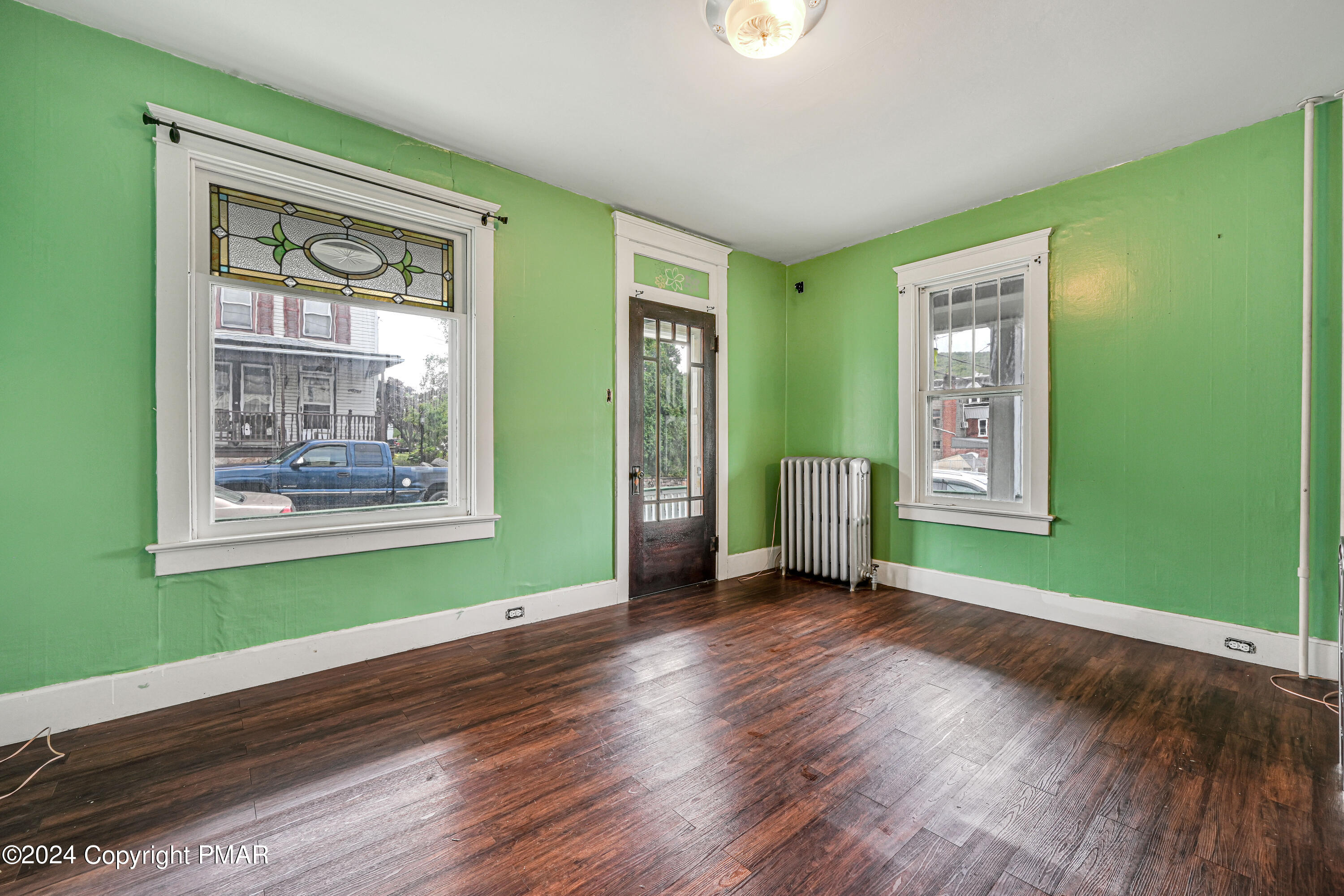 128 North West Street Williamstown, PA 17098 - Photo 4 of 23 a view of an empty room with wooden floor and a window