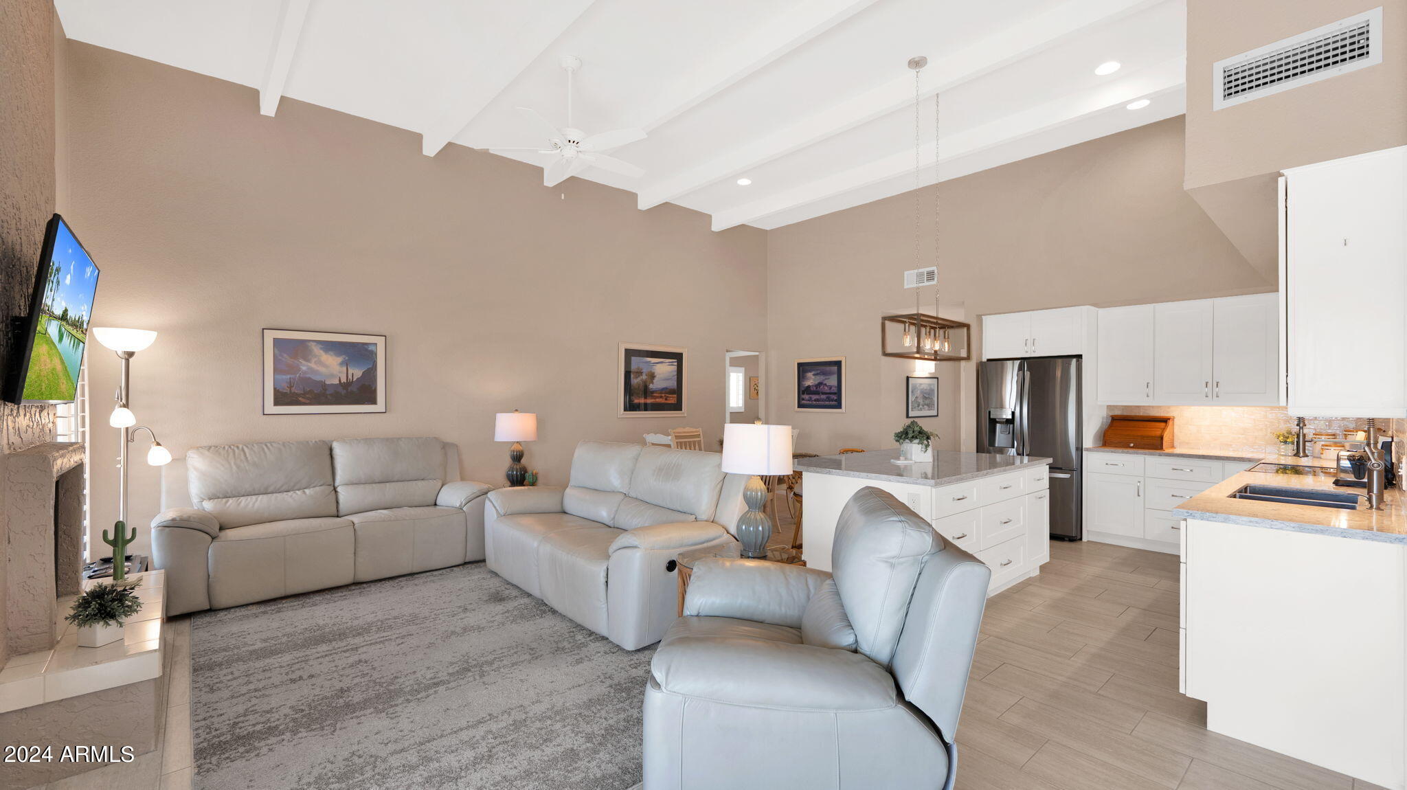 7819 East Vía Rio Scottsdale, AZ 85258 - Photo 11 of 42 a living room with furniture and a flat screen tv