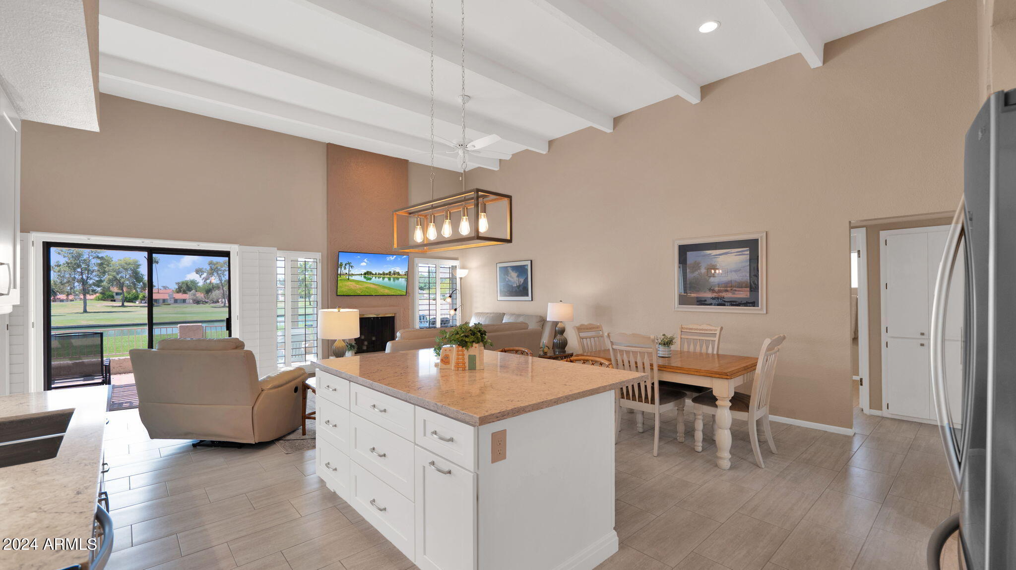 7819 East Vía Rio Scottsdale, AZ 85258 - Photo 17 of 42 a living room with furniture a flat screen tv and a large window