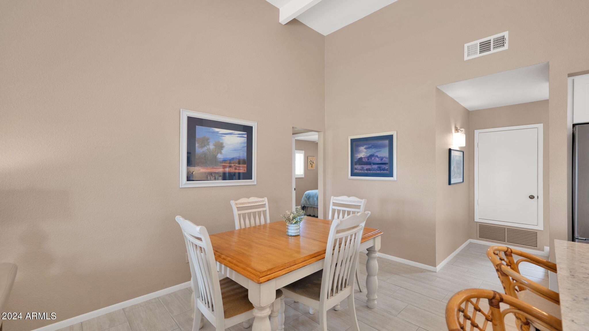 7819 East Vía Rio Scottsdale, AZ 85258 - Photo 18 of 42 a dining room with furniture and wooden floor