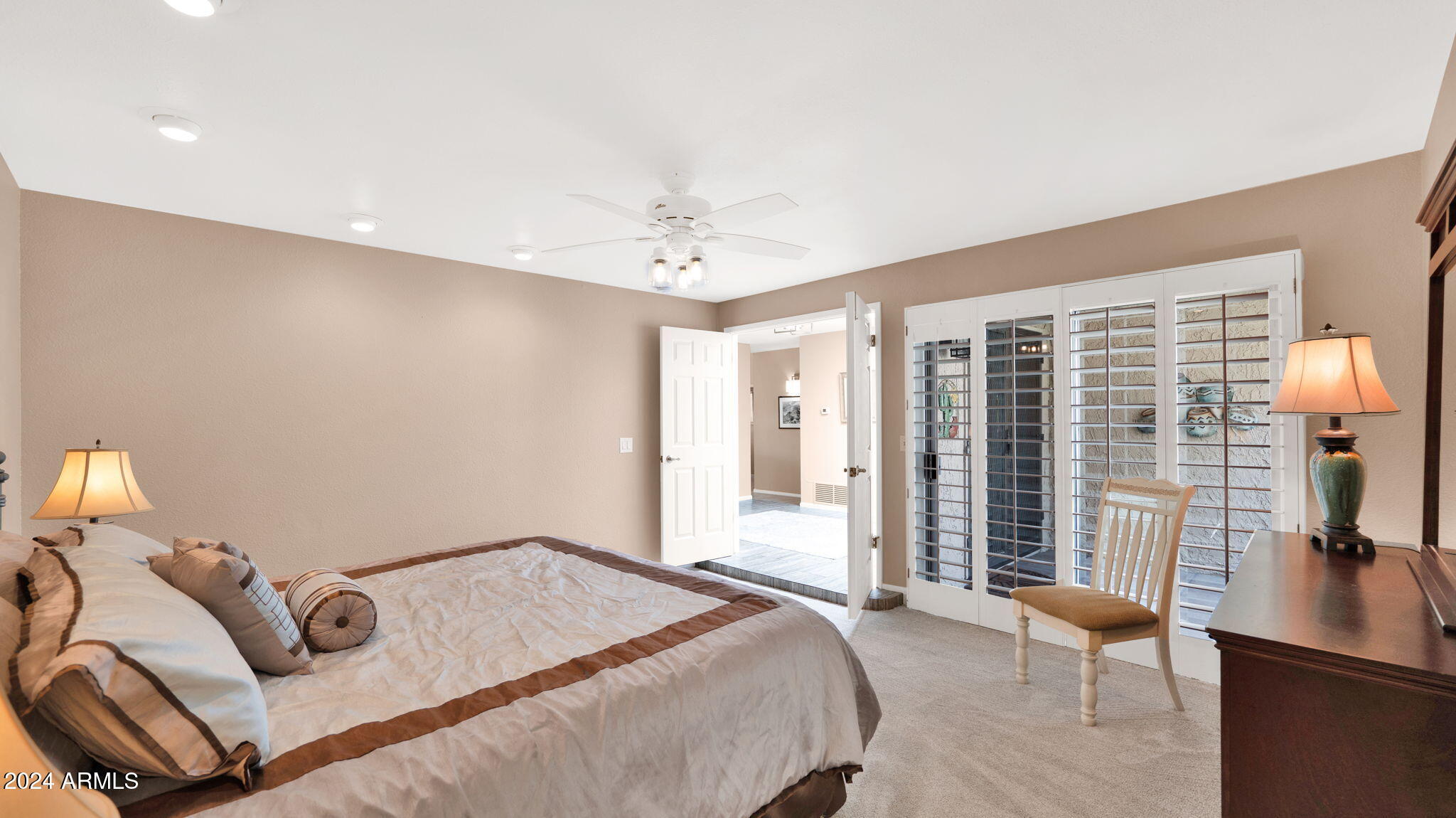 7819 East Vía Rio Scottsdale, AZ 85258 - Photo 23 of 42 a bedroom with furniture and a large window