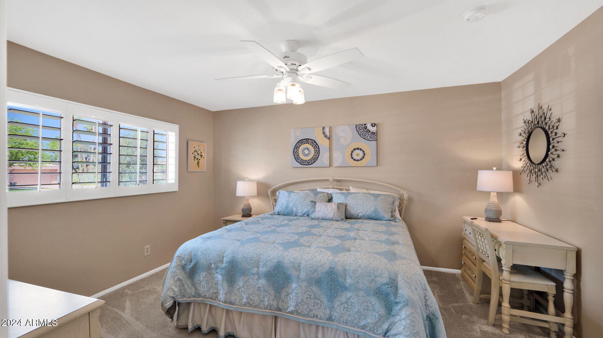 7819 East Vía Rio Scottsdale, AZ 85258 - Photo 28 of 42 a bedroom with a bed and a window