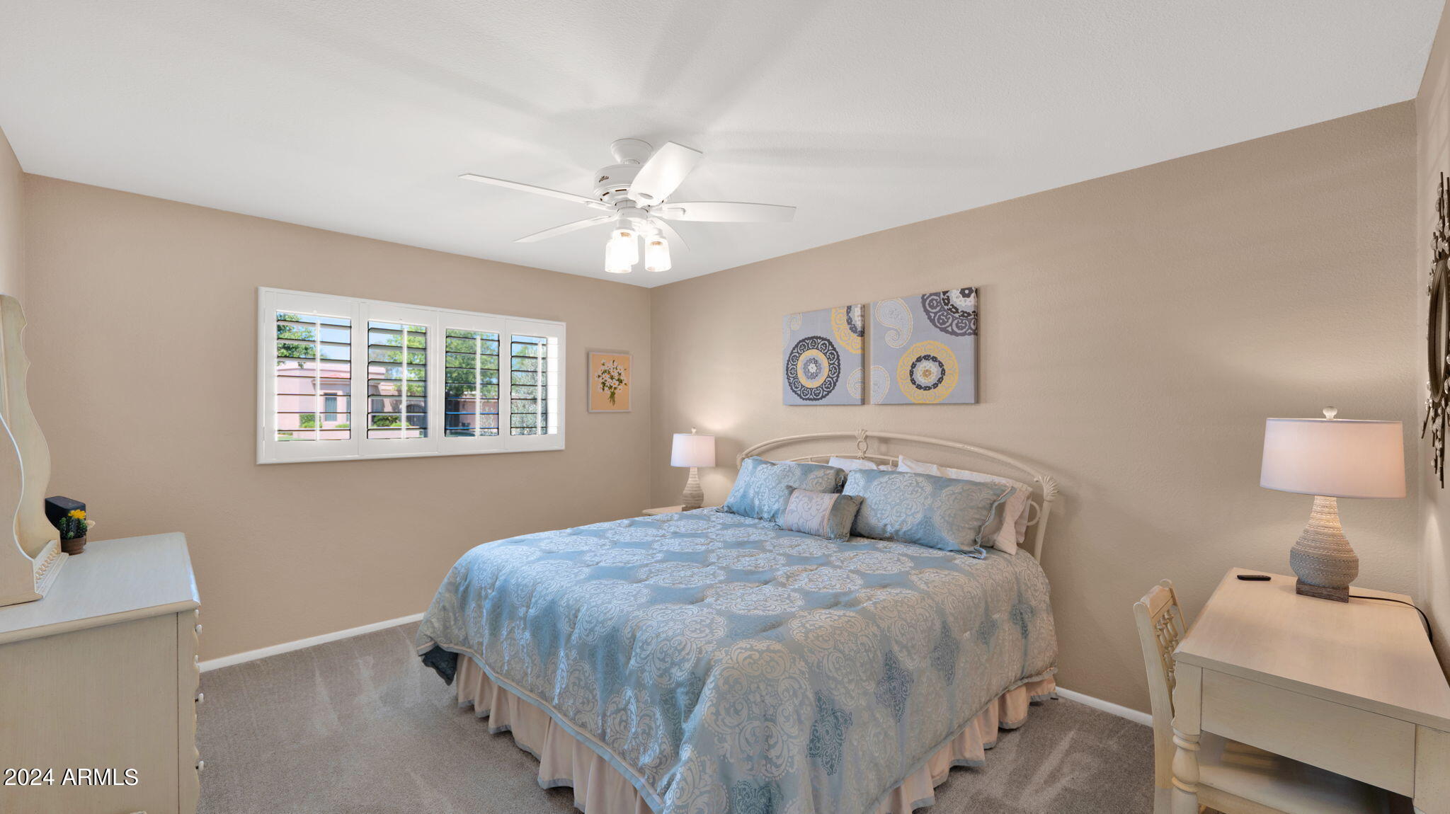 7819 East Vía Rio Scottsdale, AZ 85258 - Photo 29 of 42 a bedroom with a large bed and a window