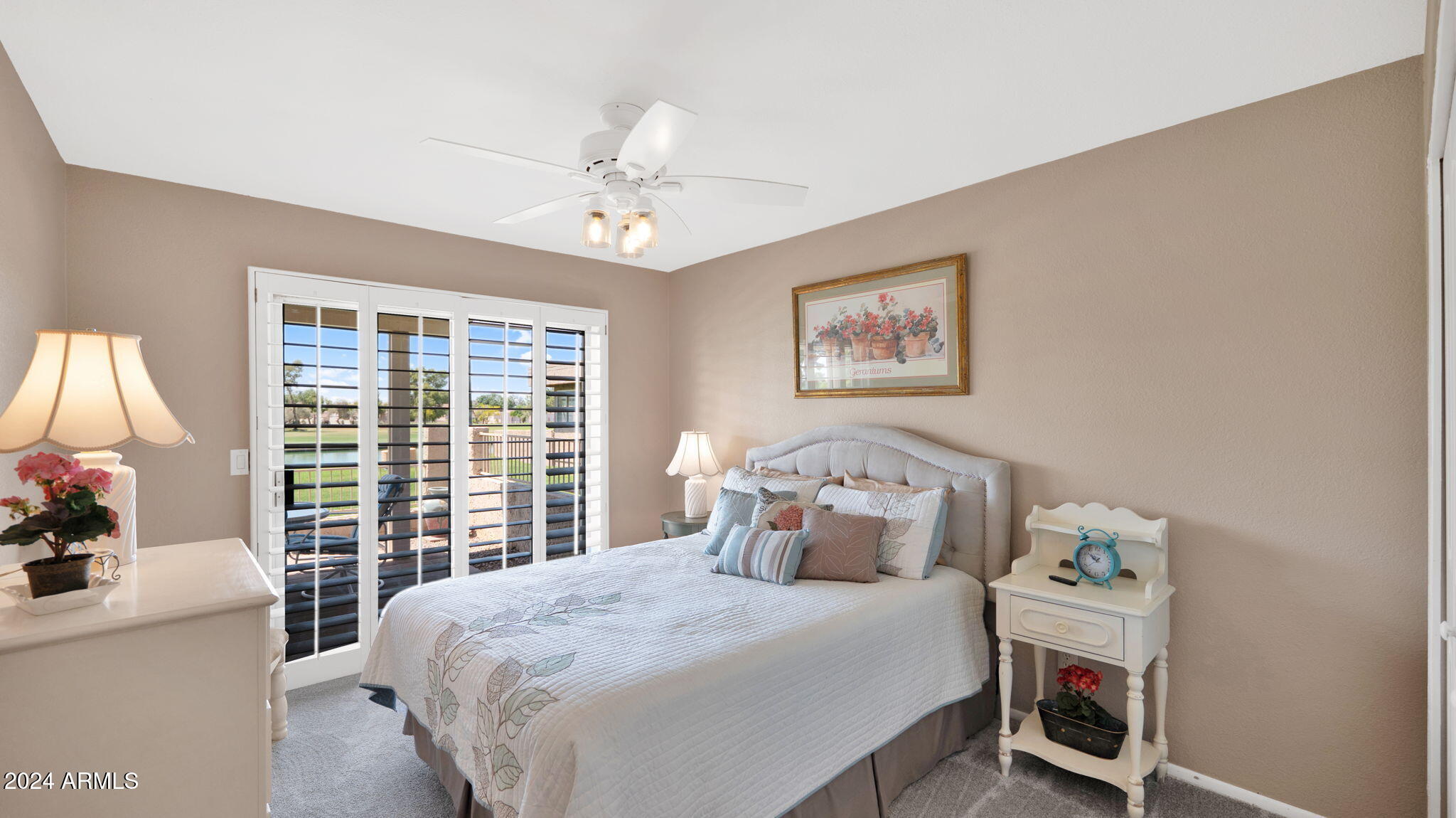 7819 East Vía Rio Scottsdale, AZ 85258 - Photo 31 of 42 a bedroom with a bed a couch and a window