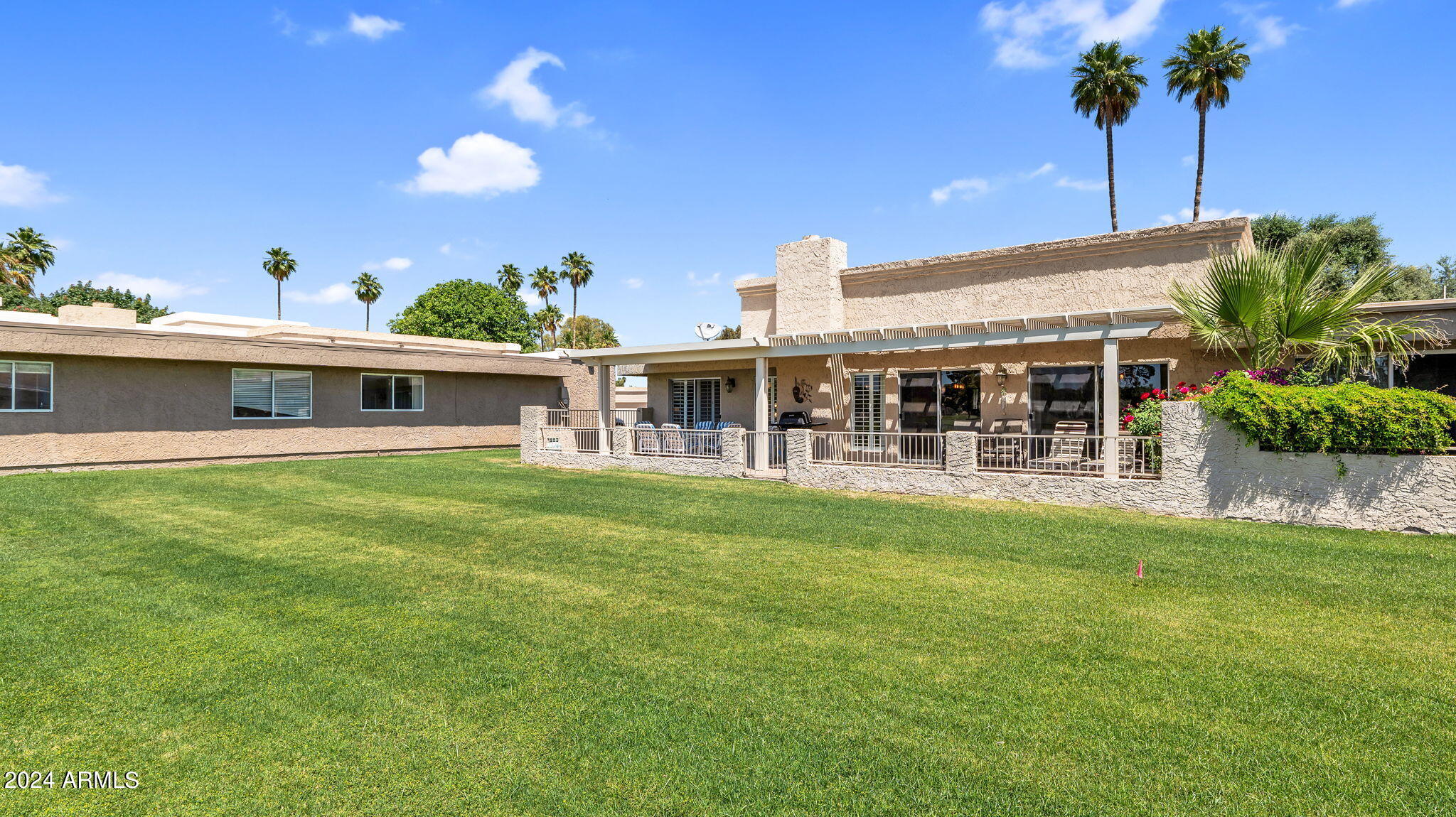 7819 East Vía Rio Scottsdale, AZ 85258 - Photo 35 of 42 a view of a house with a backyard