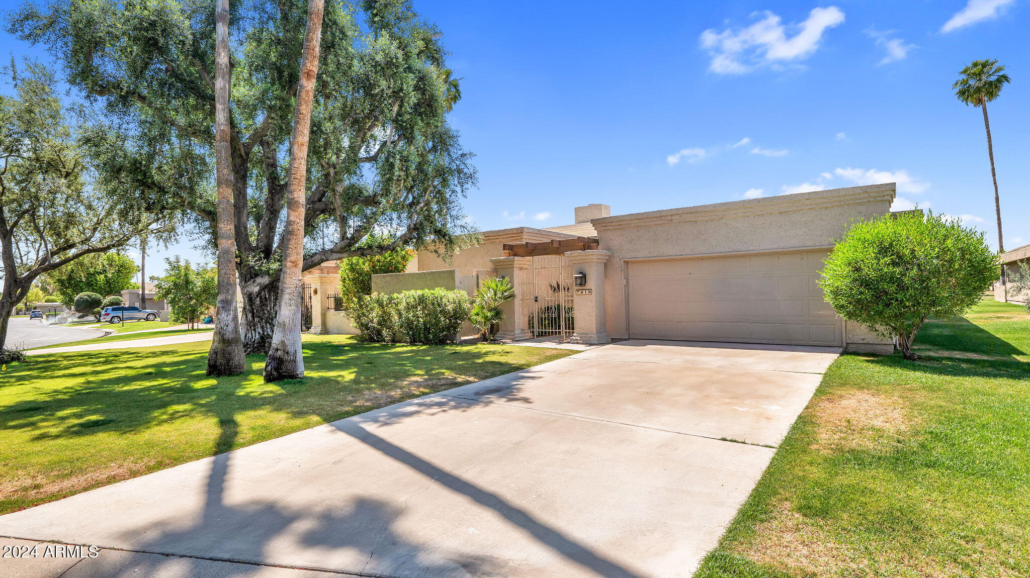 7819 East Vía Rio Scottsdale, AZ 85258 - Photo 41 of 42 a backyard of a house with a garden and plants
