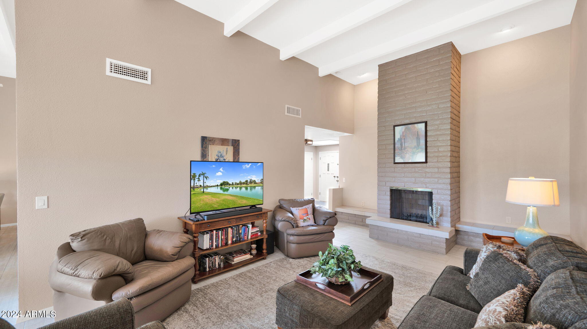 7819 East Vía Rio Scottsdale, AZ 85258 - Photo 5 of 42 a living room with furniture and a fireplace