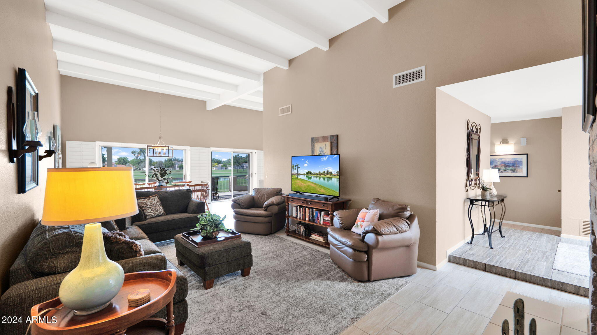 7819 East Vía Rio Scottsdale, AZ 85258 - Photo 6 of 42 a living room with furniture and a flat screen tv