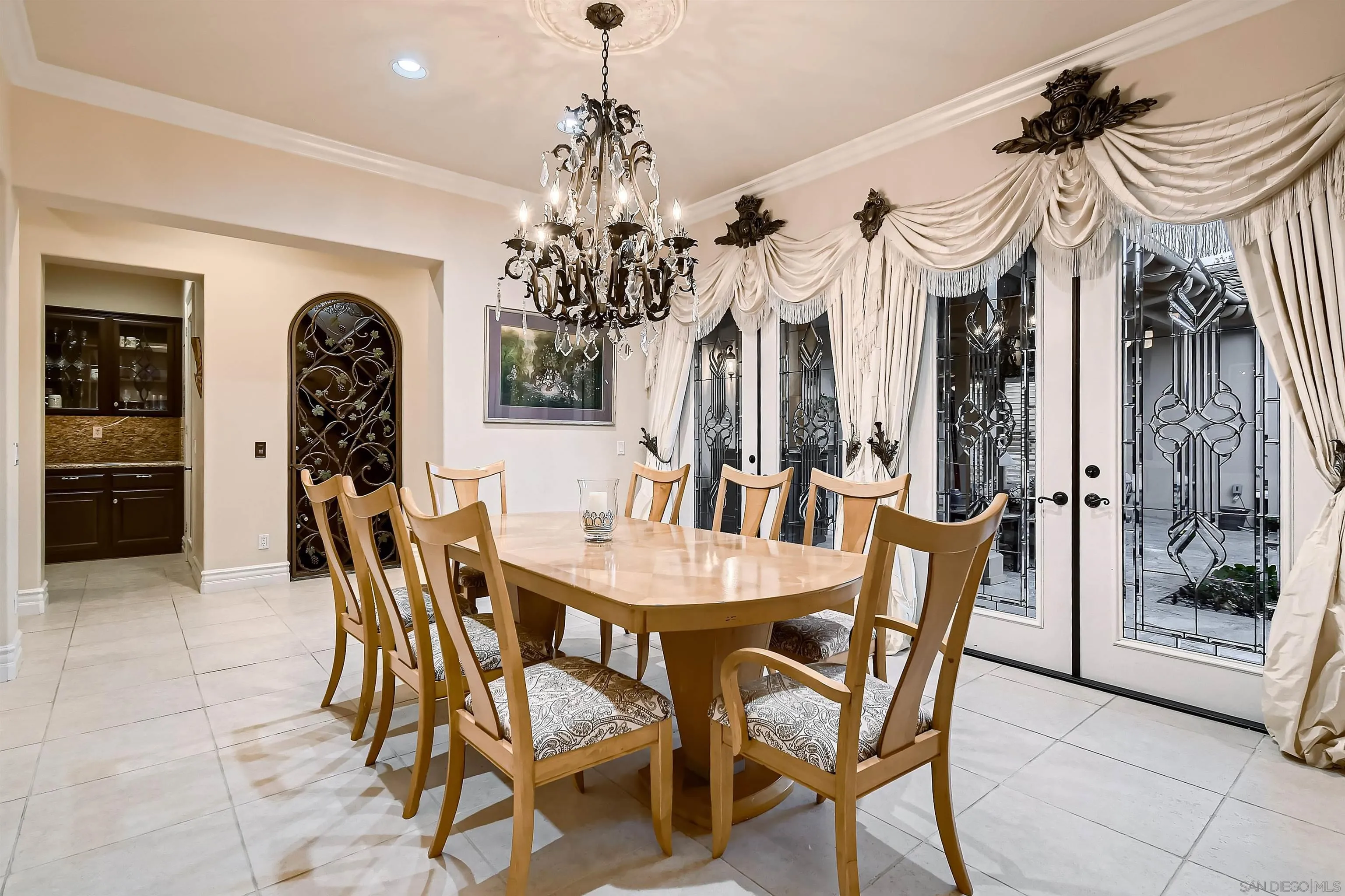 3349 Mendenaro Court Fallbrook, CA 92028 - Photo 11 of 31 a view of a dining room with furniture and chandelier
