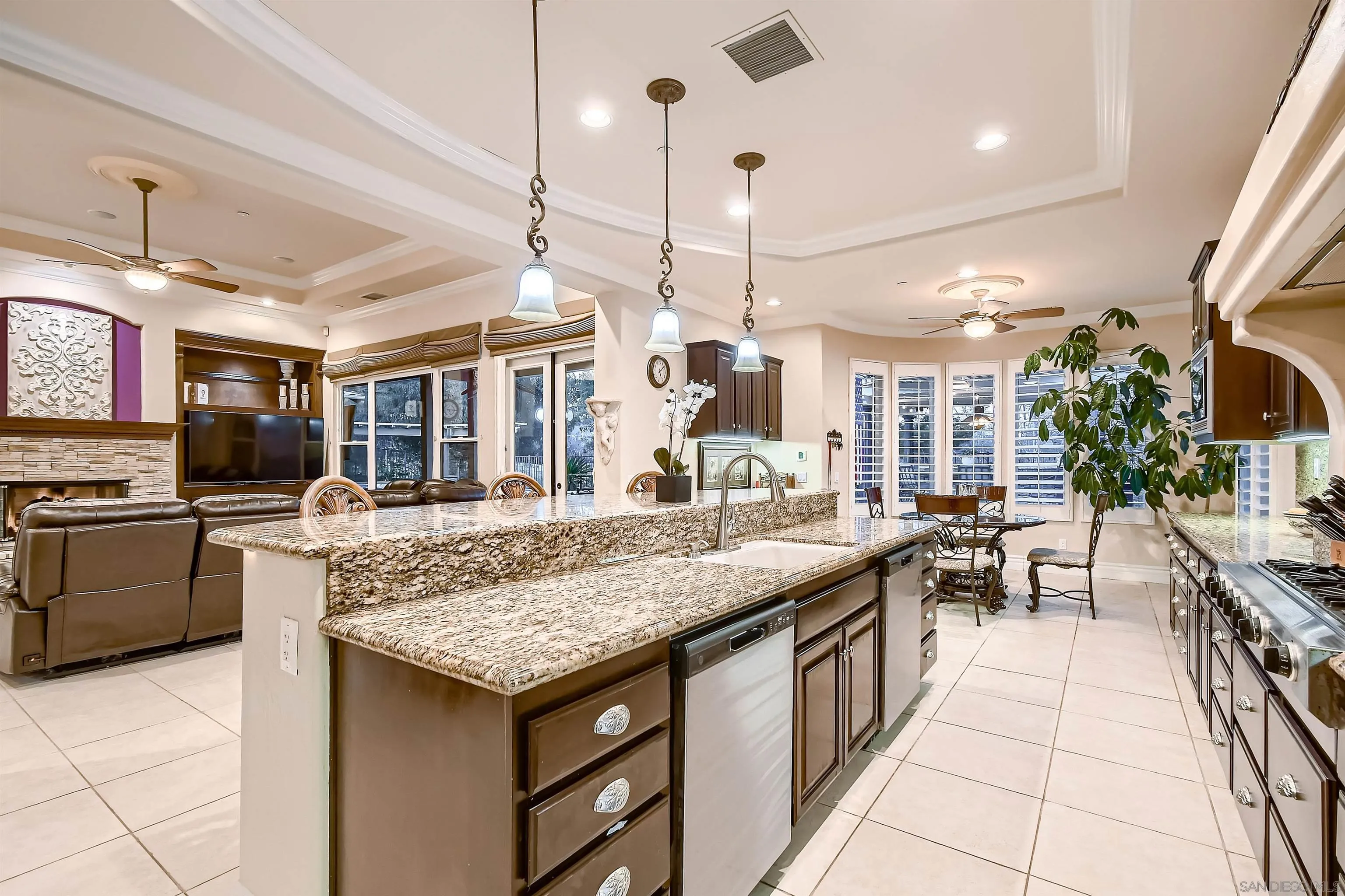 3349 Mendenaro Court Fallbrook, CA 92028 - Photo 13 of 31 a kitchen with granite countertop a stove and a sink