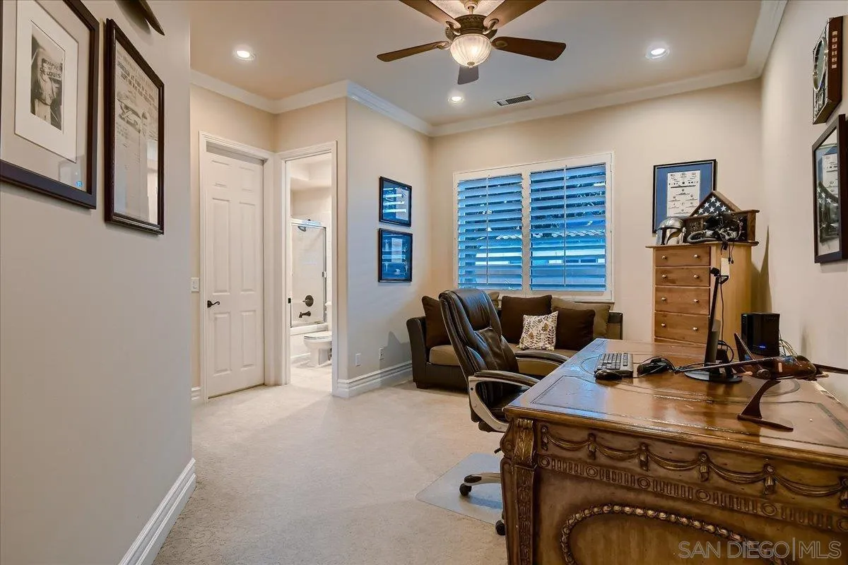 3349 Mendenaro Court Fallbrook, CA 92028 - Photo 17 of 34 a view of a workspace with furniture and a window