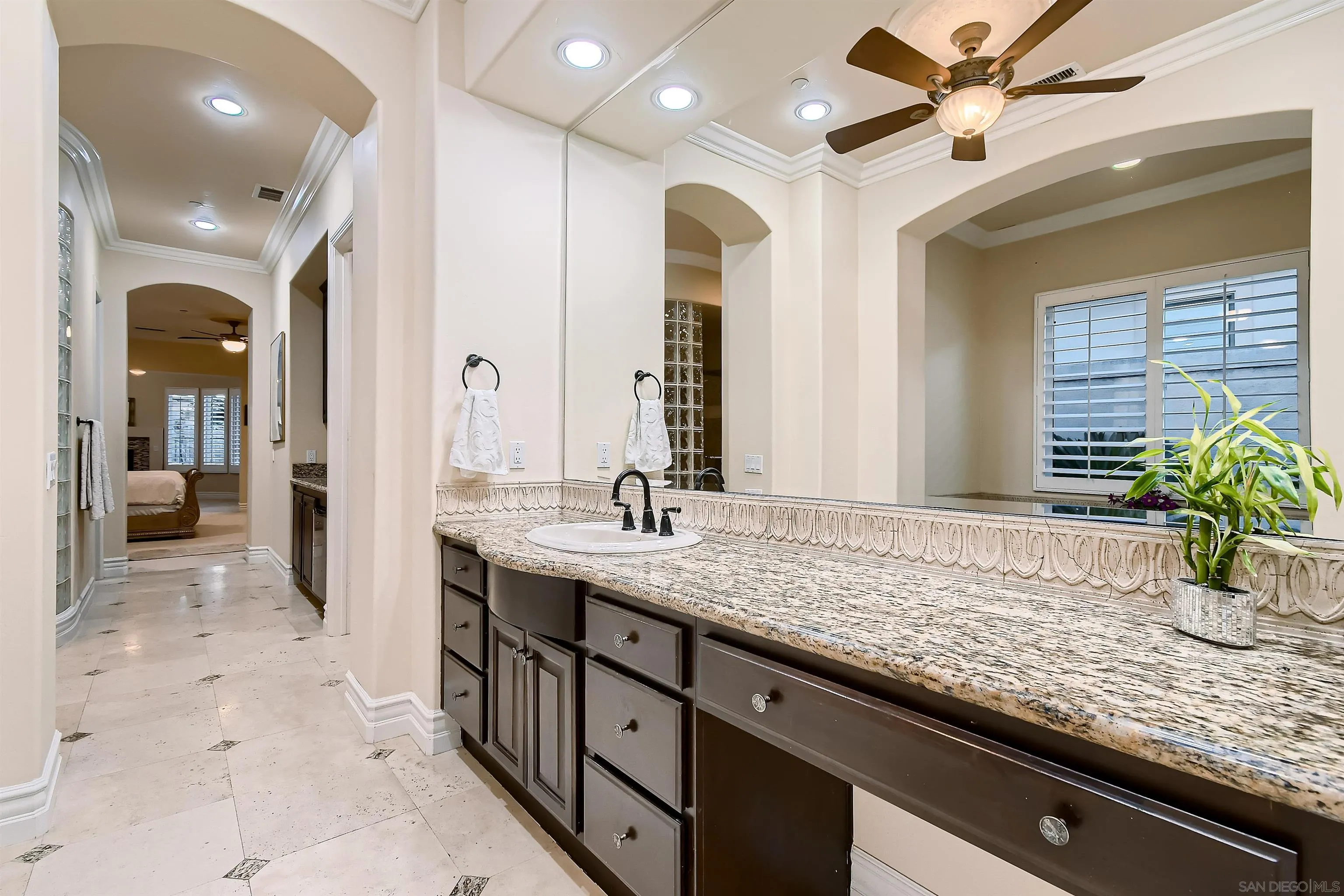 3349 Mendenaro Court Fallbrook, CA 92028 - Photo 18 of 31 a bathroom with a granite countertop sink and a mirror
