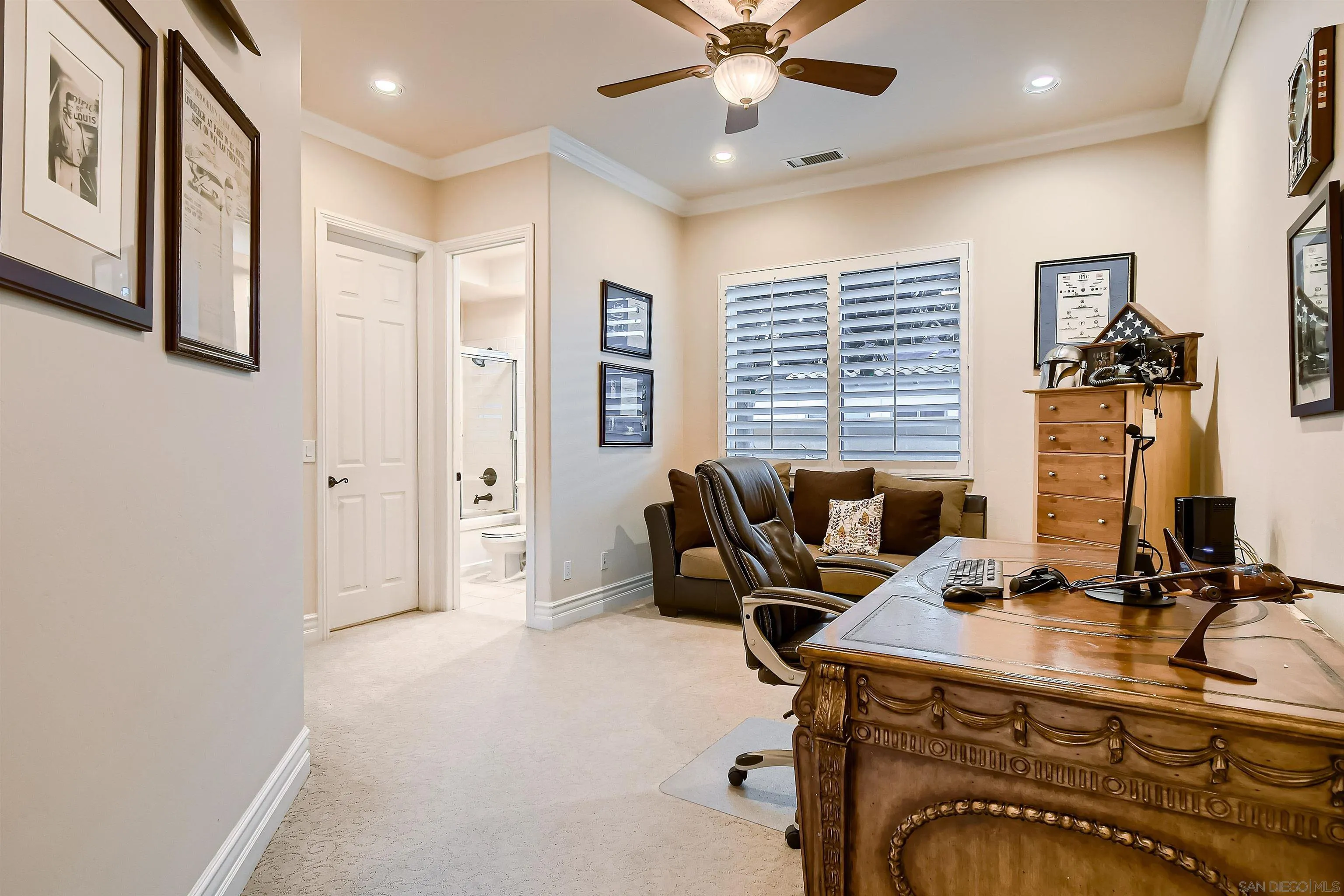 3349 Mendenaro Court Fallbrook, CA 92028 - Photo 22 of 31 a view of a workspace with furniture and a window