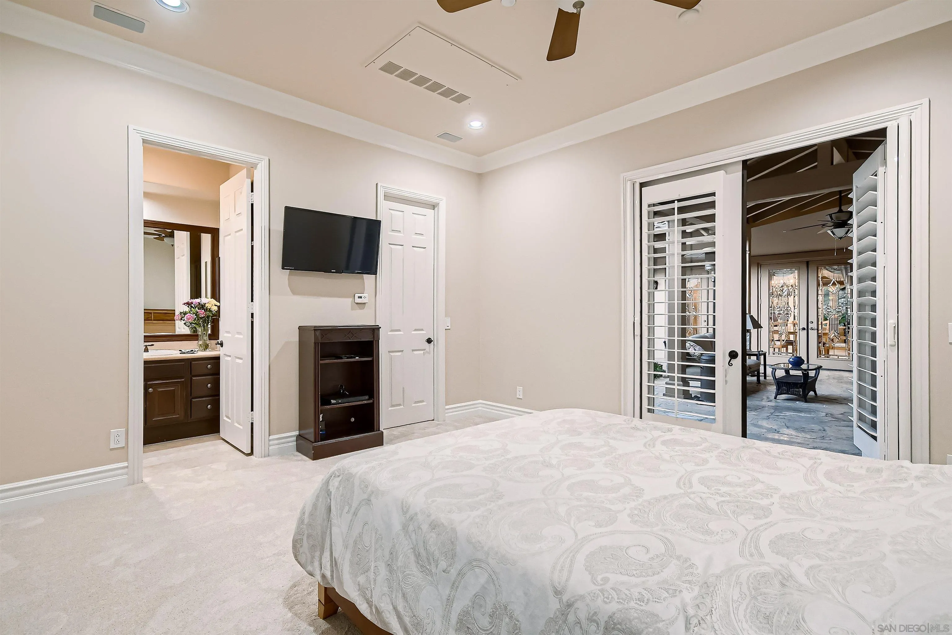 3349 Mendenaro Court Fallbrook, CA 92028 - Photo 27 of 31 a bedroom with a bed and a television