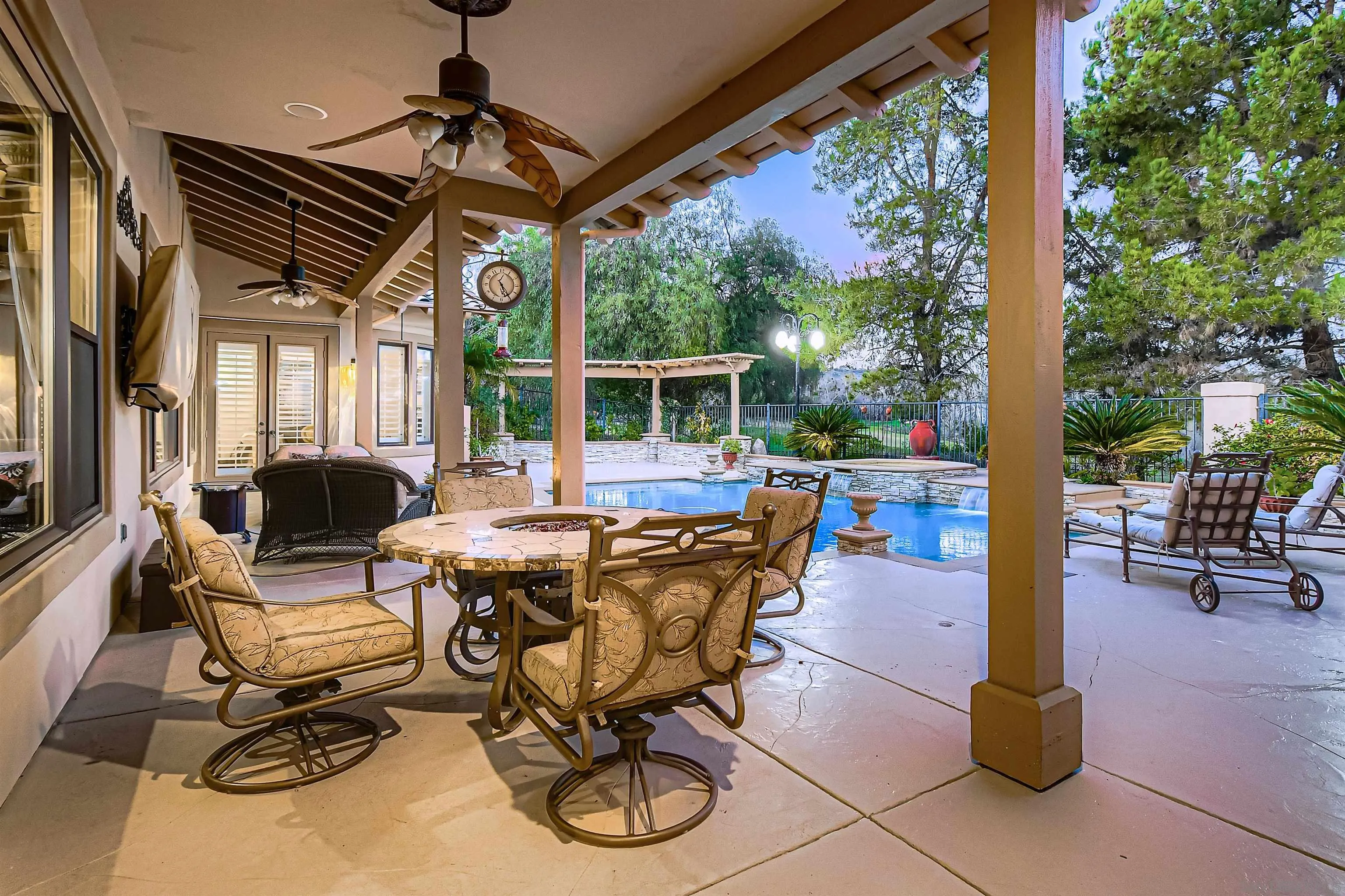 3349 Mendenaro Court Fallbrook, CA 92028 - Photo 30 of 31 a view of a patio with a dining table and chairs