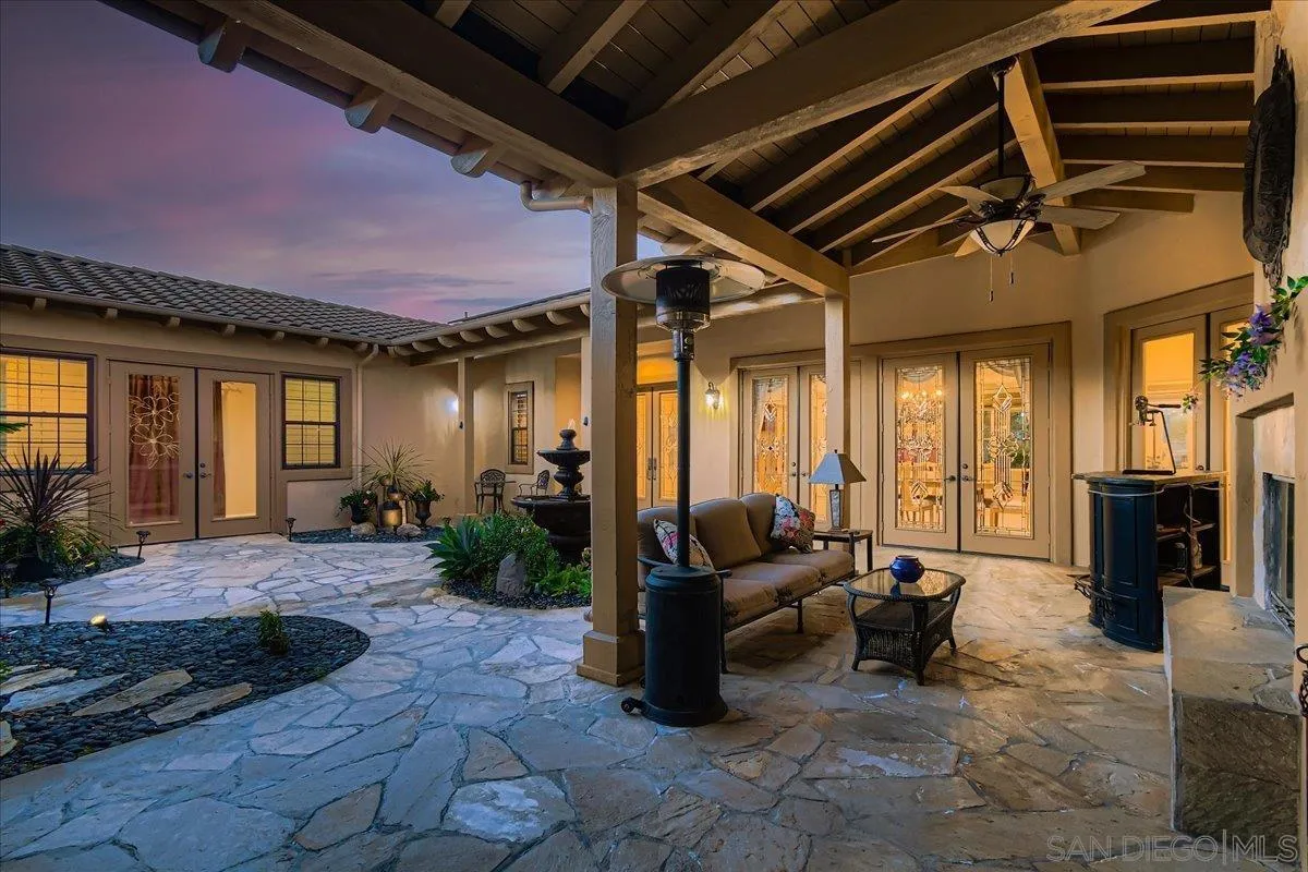 3349 Mendenaro Court Fallbrook, CA 92028 - Photo 6 of 34 a view of a patio with table and chairs