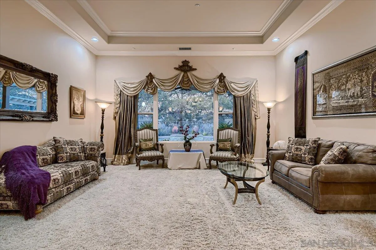 3349 Mendenaro Court Fallbrook, CA 92028 - Photo 8 of 34 a living room with furniture and a fireplace