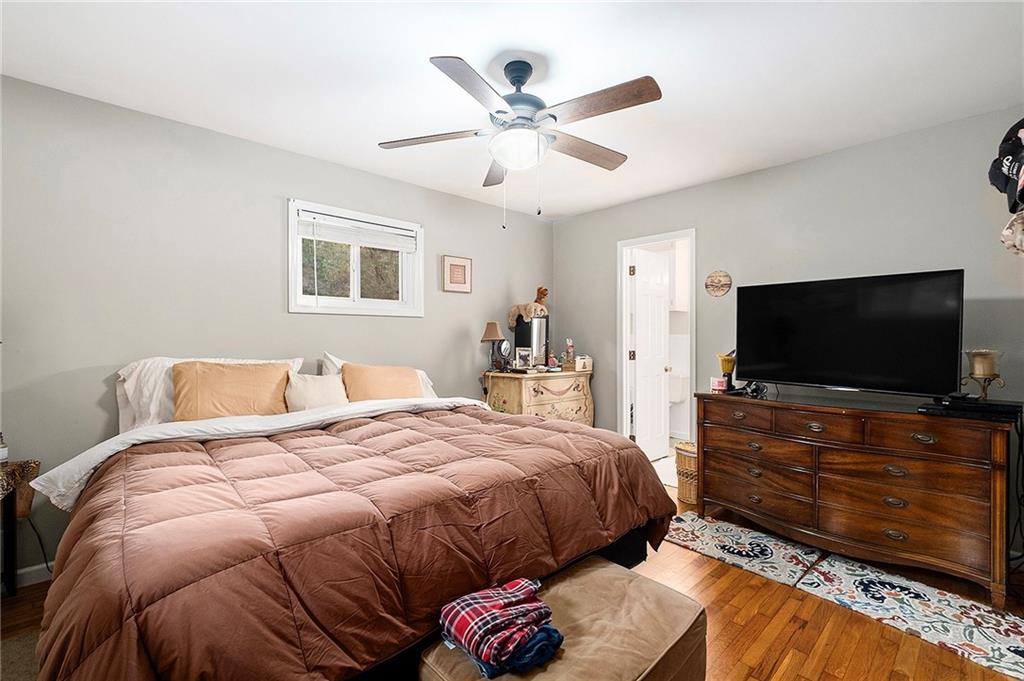 1246 Duncan Bridge Road Cornelia, GA 30531 - Photo 15 of 21 a bedroom with a bed and a flat screen tv