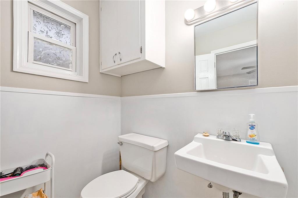 1246 Duncan Bridge Road Cornelia, GA 30531 - Photo 16 of 21 a bathroom with a toilet sink and mirror