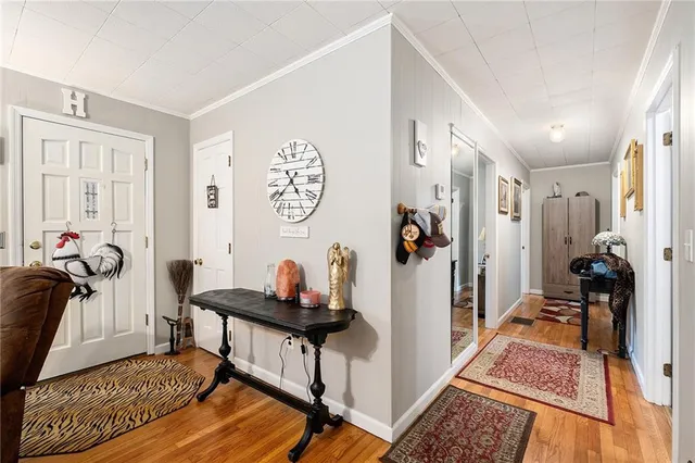 a living room with furniture fireplace and a table