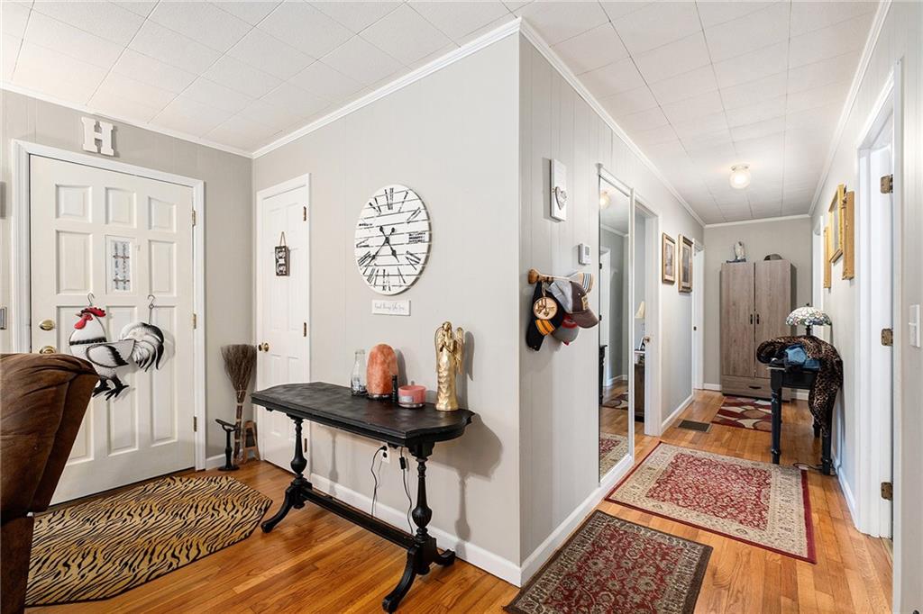 1246 Duncan Bridge Road Cornelia, GA 30531 - Photo 2 of 21 a living room with furniture and a rug
