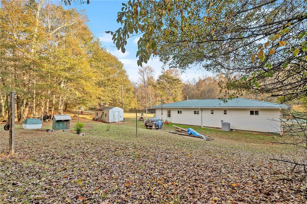 1246 Duncan Bridge Road Cornelia, GA 30531 - Photo 21 of 21 a view of a house with a yard
