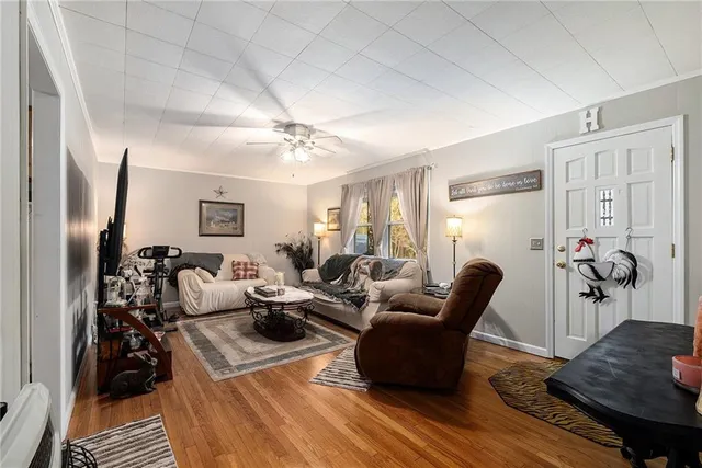 a kitchen with stainless steel appliances a stove a sink and a microwave